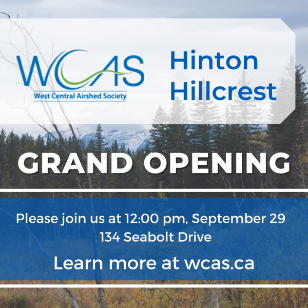 An image of a forested area in Hinton, with text that reads WCAS Hinton Hillcrest Grand Opening Please join us at 12:00 pm, September 29. 134 Seabold Drive. Learn more at wcas.ca